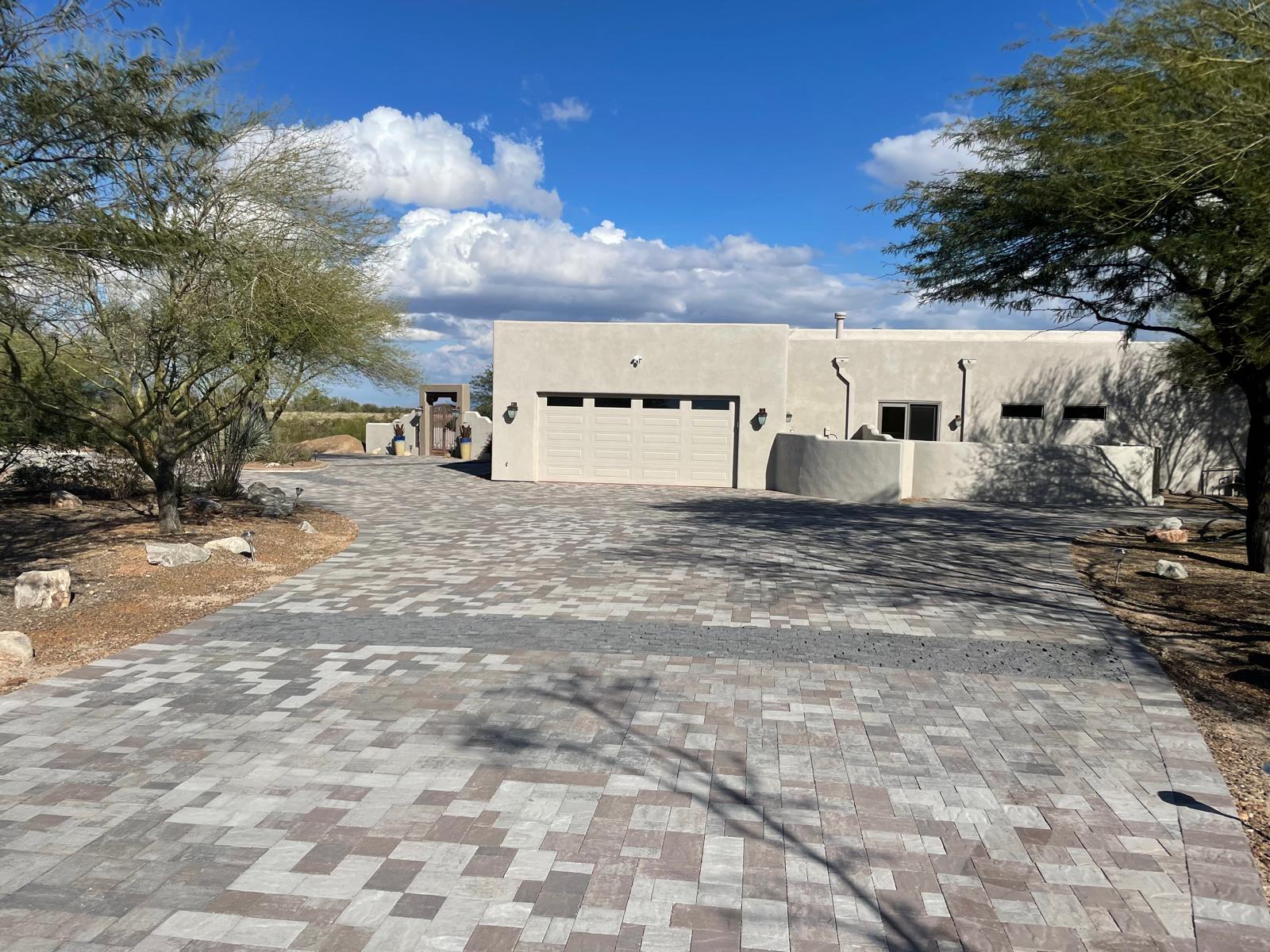 Modern checkerboard pattern paver driveway at a contemporary Arizona home